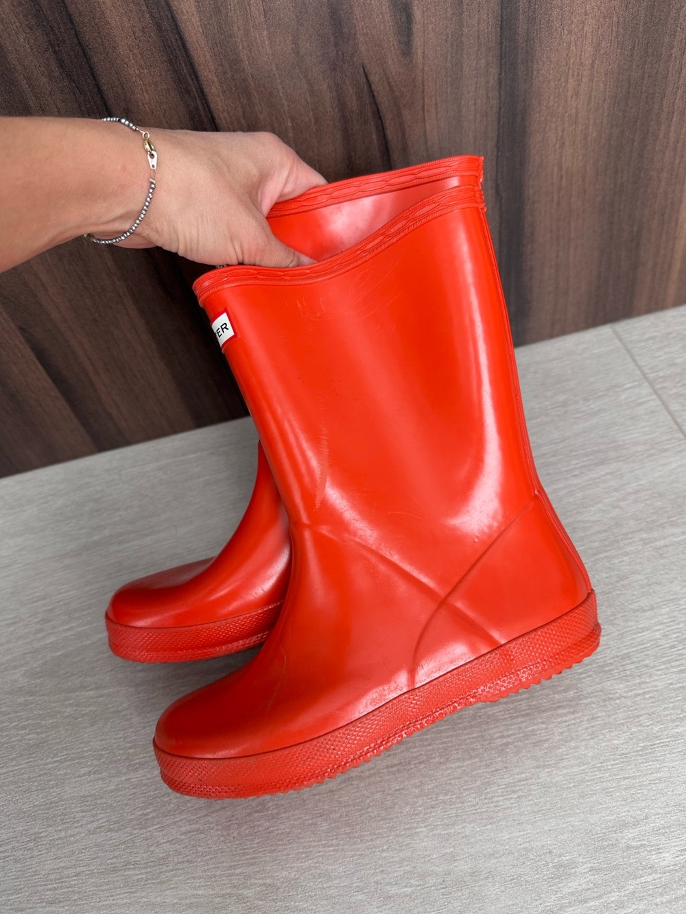 Hunter orangy/red glossy rain boots